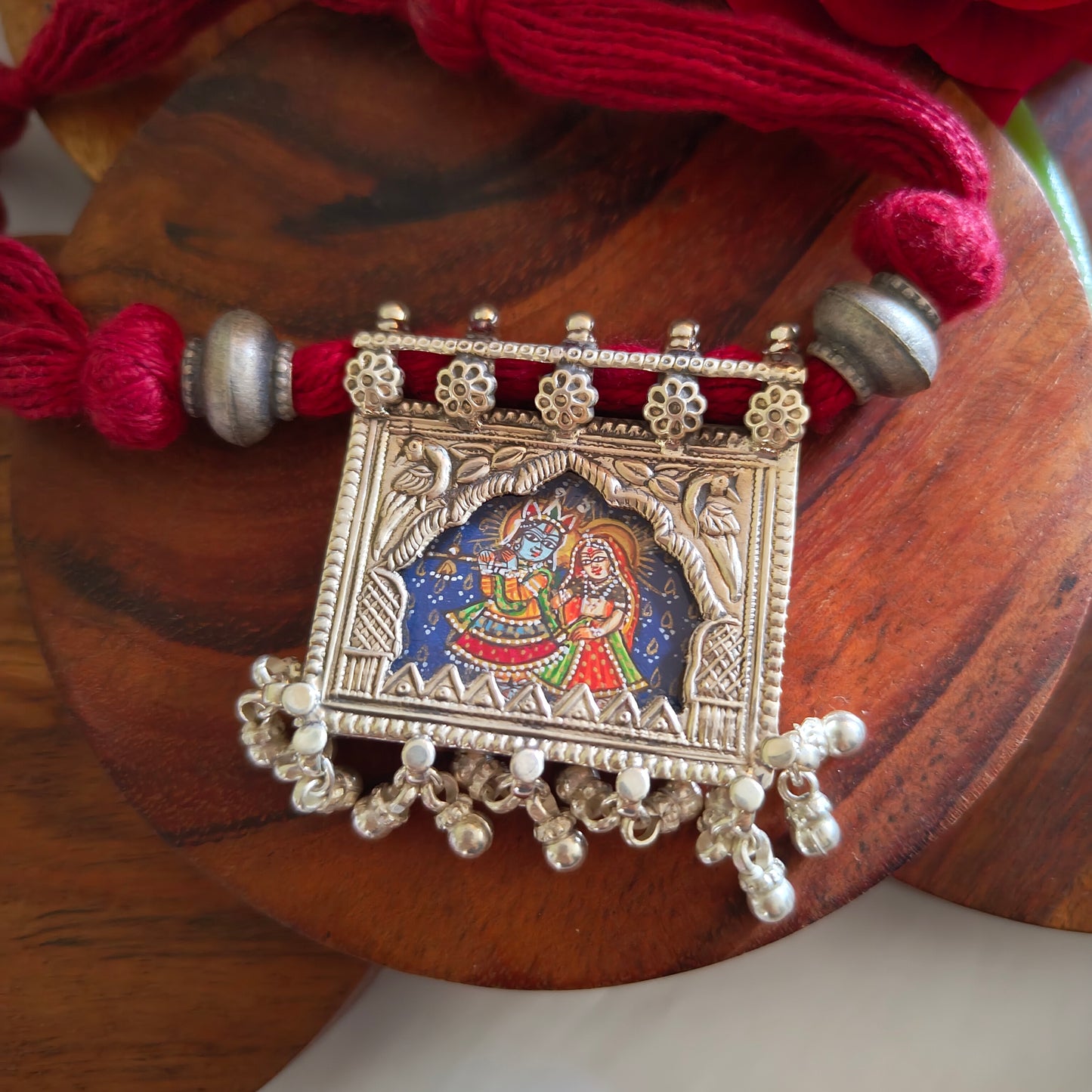Radha Krishna Hand Painted Jharoka Pendant with Silver Ball Danglers and Maroon Thread Necklace Blue Bg
