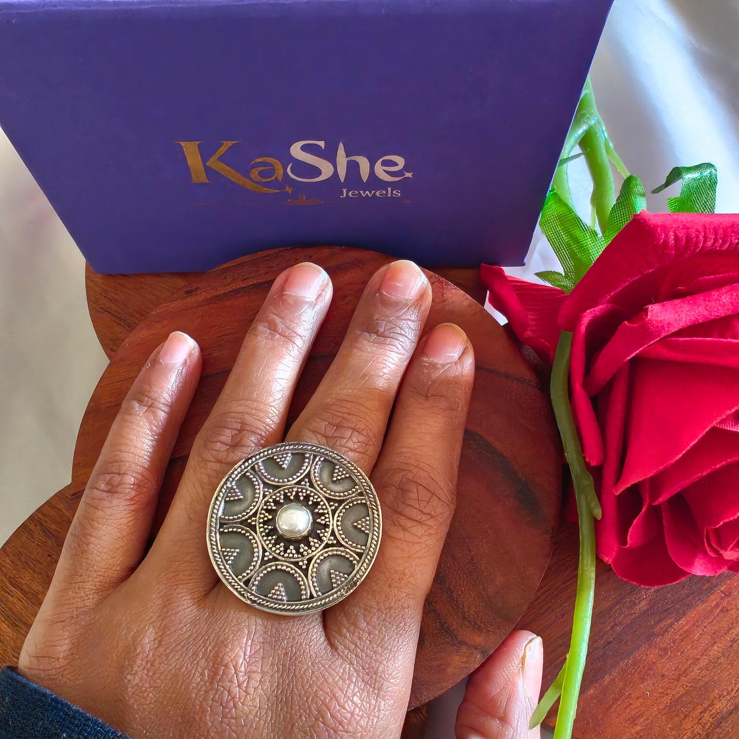 Circular Ring With Embossed Rava Design And Pearl