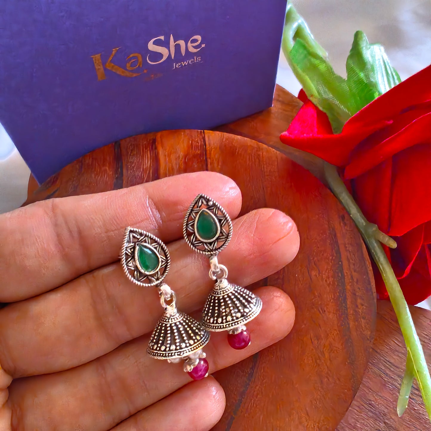 Elegant Pear Intricate Stud Green And Pink Stone Jhumki Earrings With Bud Pearl And Stone Drops
