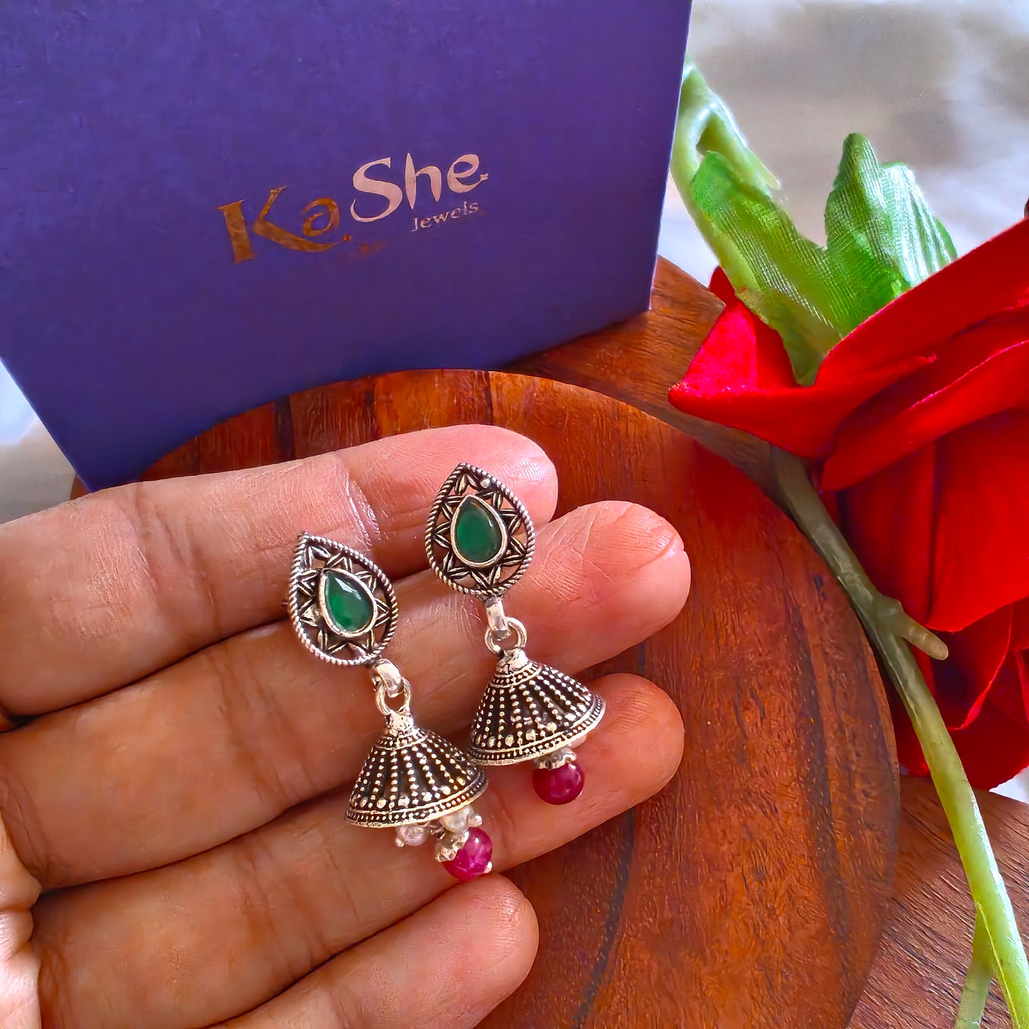 Elegant Pear Intricate Stud Green And Pink Stone Jhumki Earrings With Bud Pearl And Stone Drops