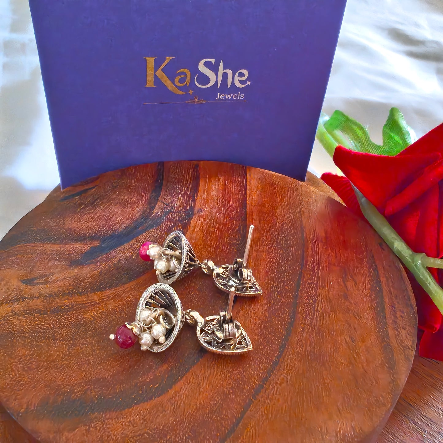 Elegant Pear Intricate Stud Green And Pink Stone Jhumki Earrings With Bud Pearl And Stone Drops
