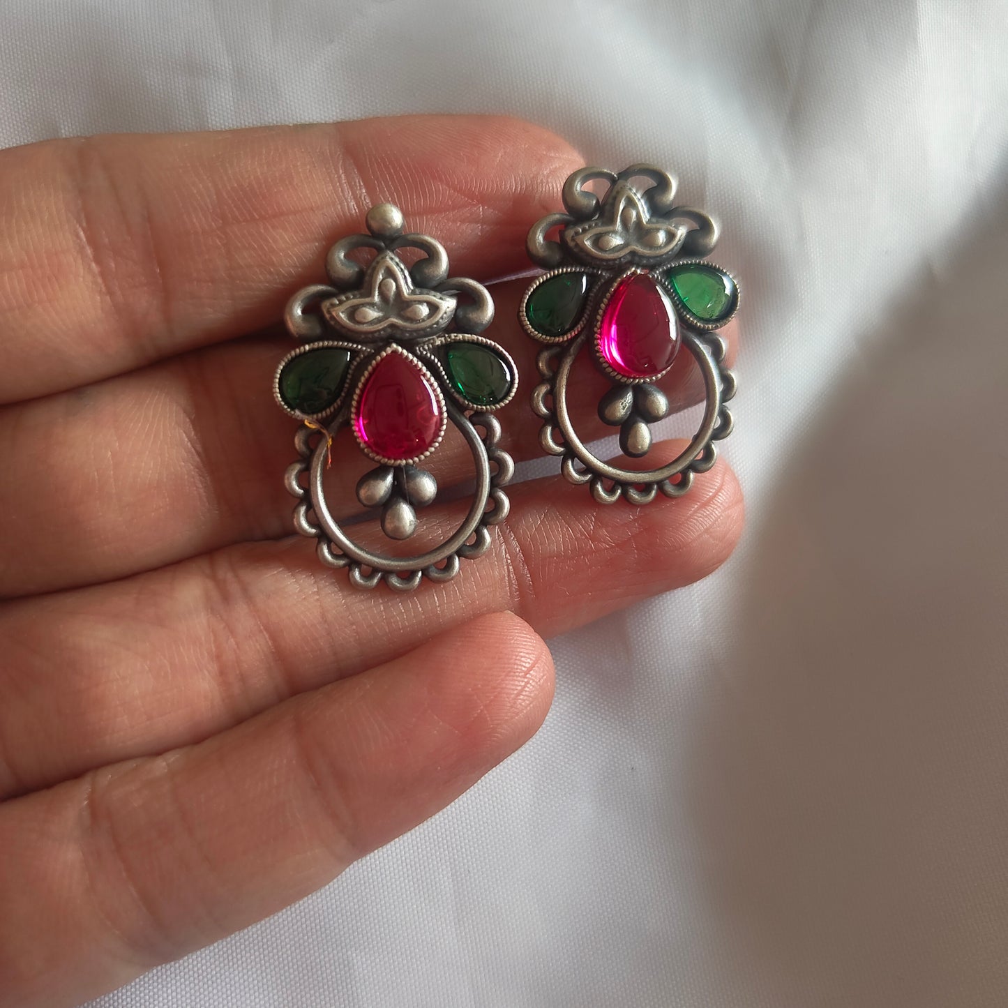 Intricate Handcrafted Pink and Green Stone Studs Silver Temple Stud Earrings