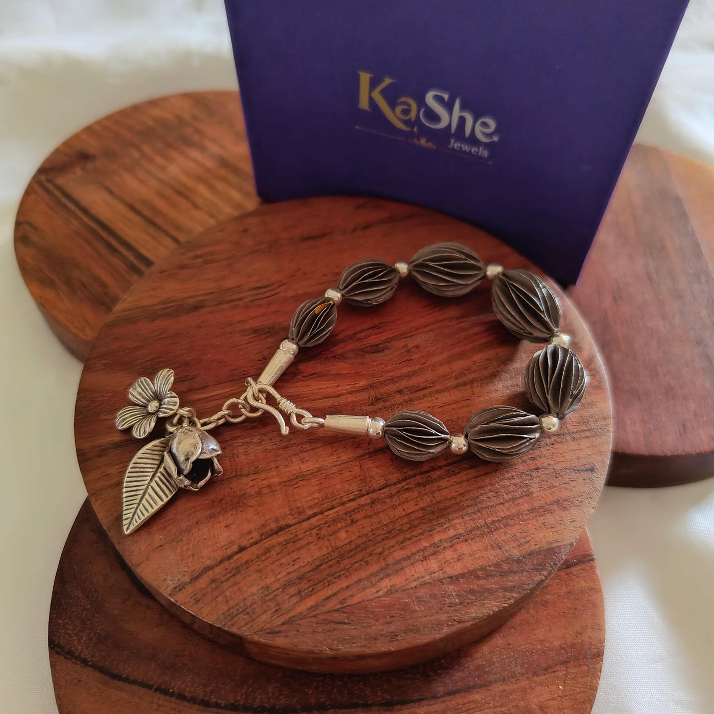 Exquisite Loose Bracelet Oxidised Polished With Flowers Bud And Leaf Charms