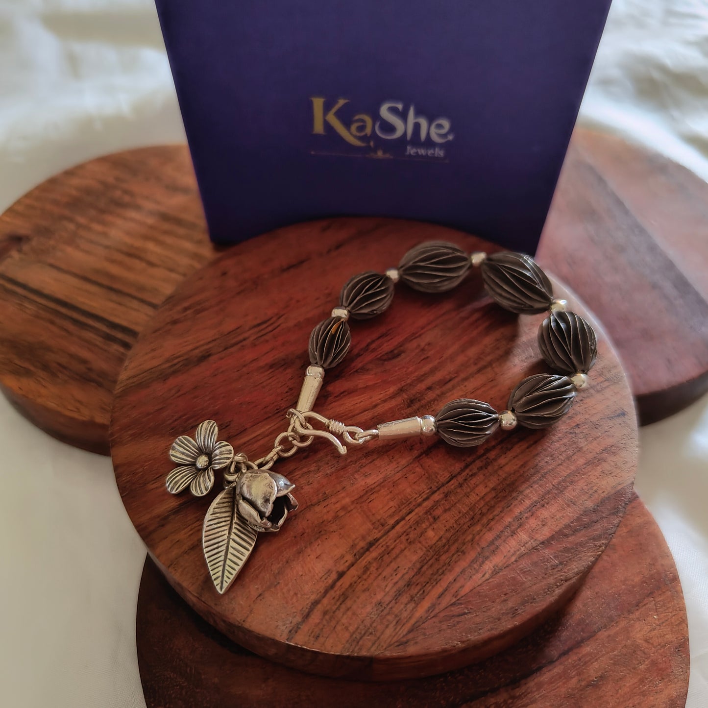Exquisite Loose Bracelet Oxidised Polished With Flowers Bud And Leaf Charms