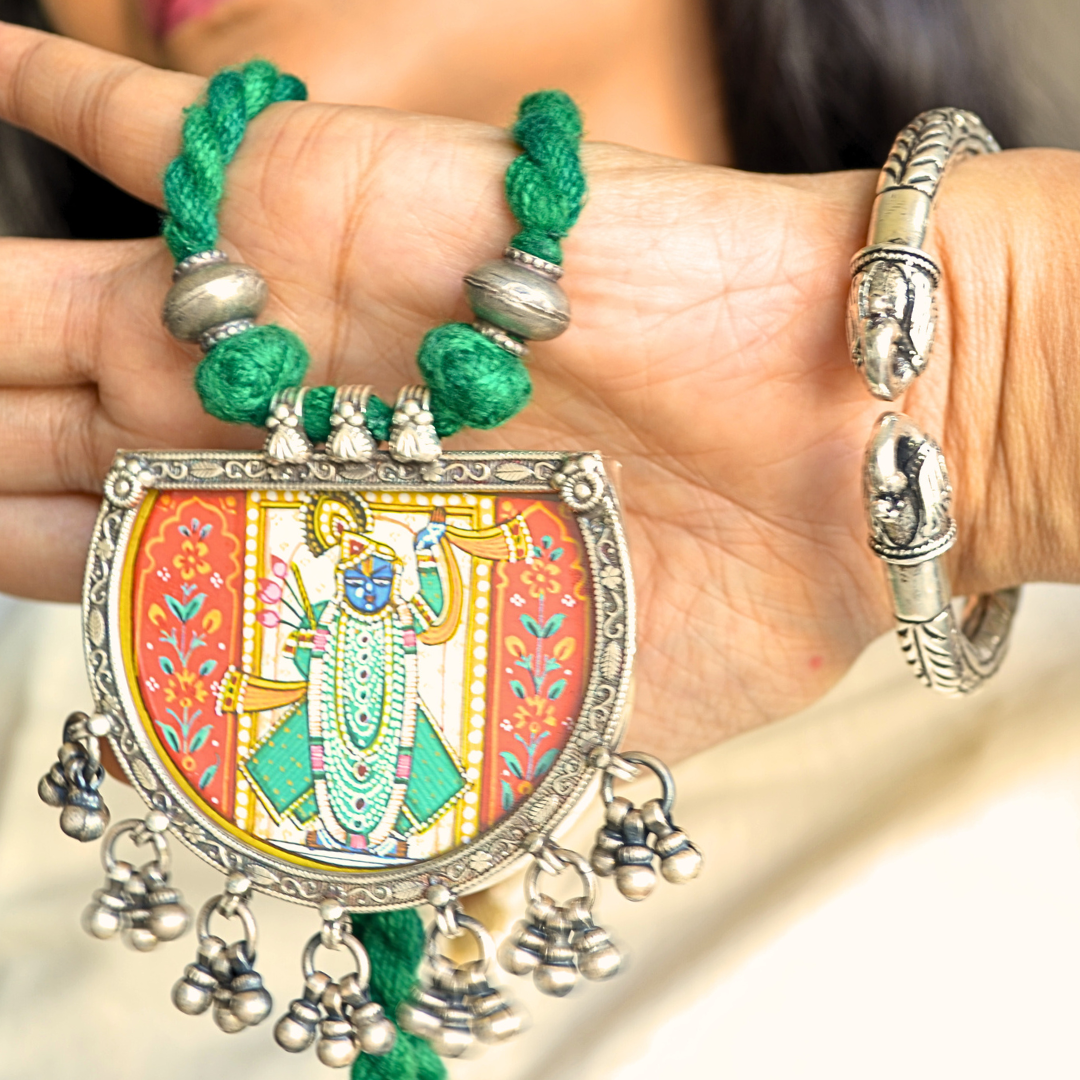 Shreenathji Hand Painted Pendant with Silver Ball Danglers and Green Thread Dori Necklace
