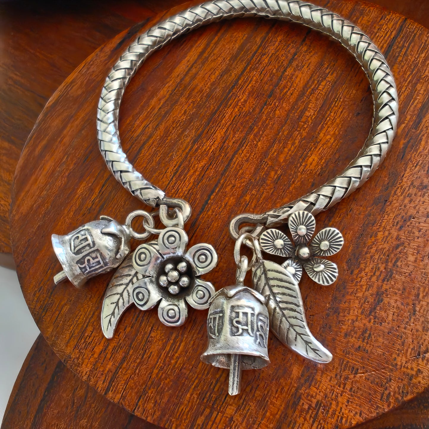 Exclusive Braided Sterling Silver Charms Kada With Bell, Flower And Leaves