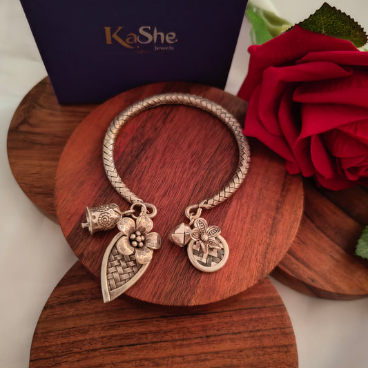Exclusive Braided Sterling Silver Charms Kada With Flowers Leaves and Bell