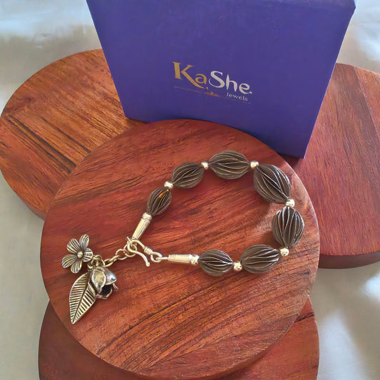 Exquisite Loose Bracelet Oxidised Polished With Flowers Bud And Leaf Charms