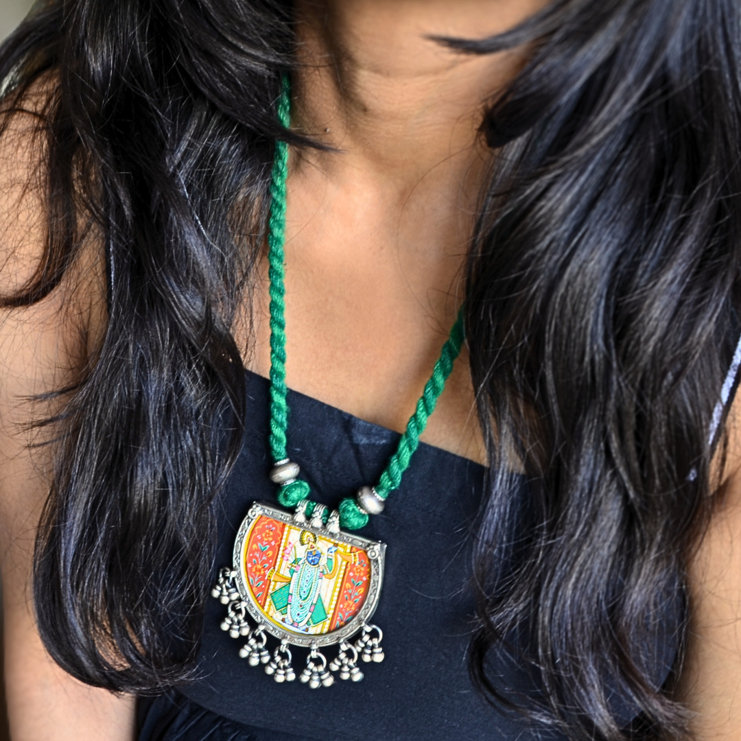 Shreenathji Hand Painted Pendant with Silver Ball Danglers and Green Thread Dori Necklace